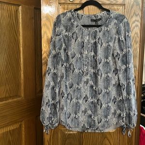 Multi colored button up blue blouse.